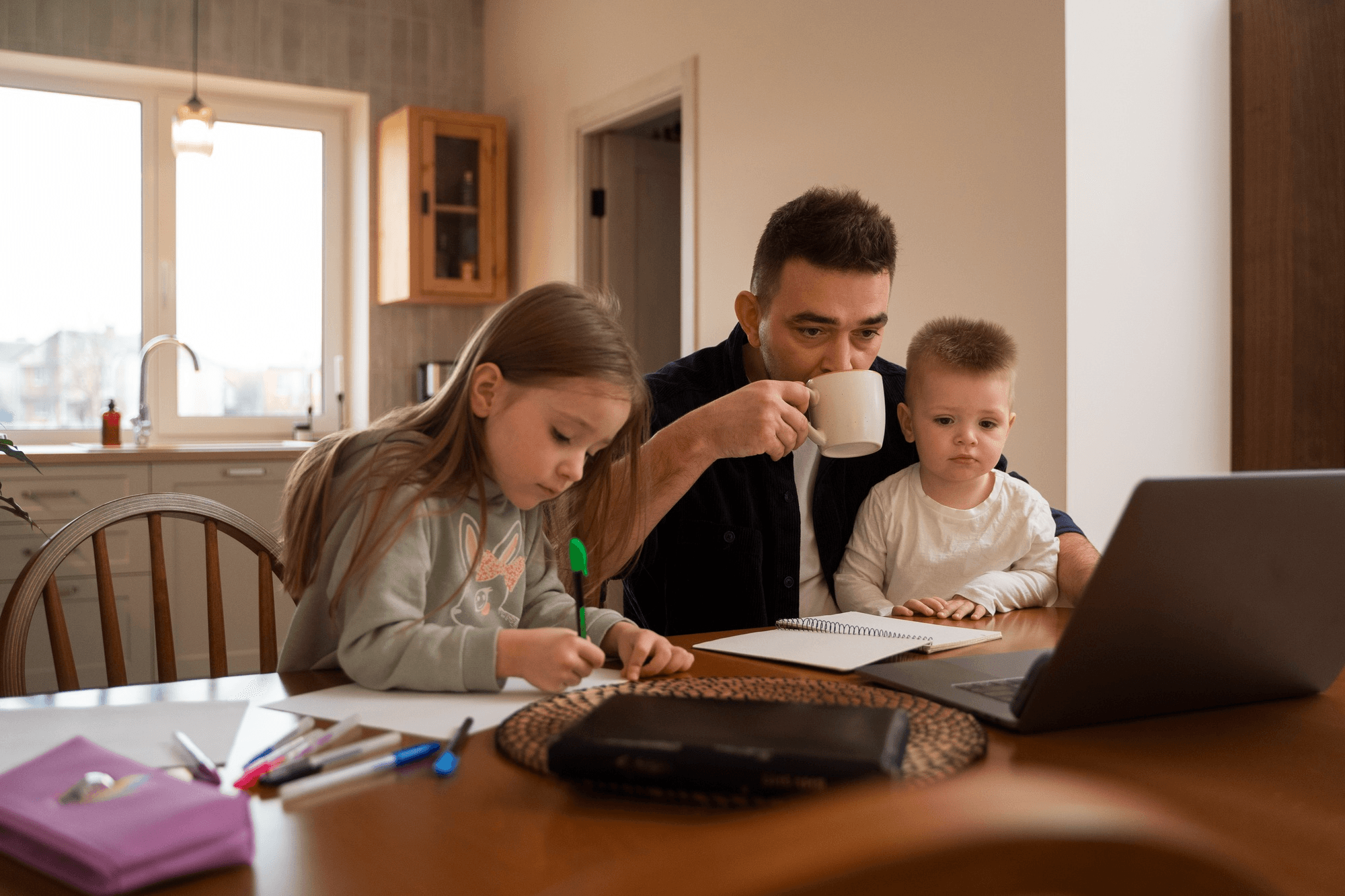 Father guiding children at study table with interactive tablet and Islamic lesson books